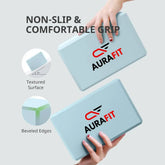 Two light blue AuraFit High-Density EVA Foam Yoga Block with AuraFit logo, showing non-slip surface and comfortable grip.