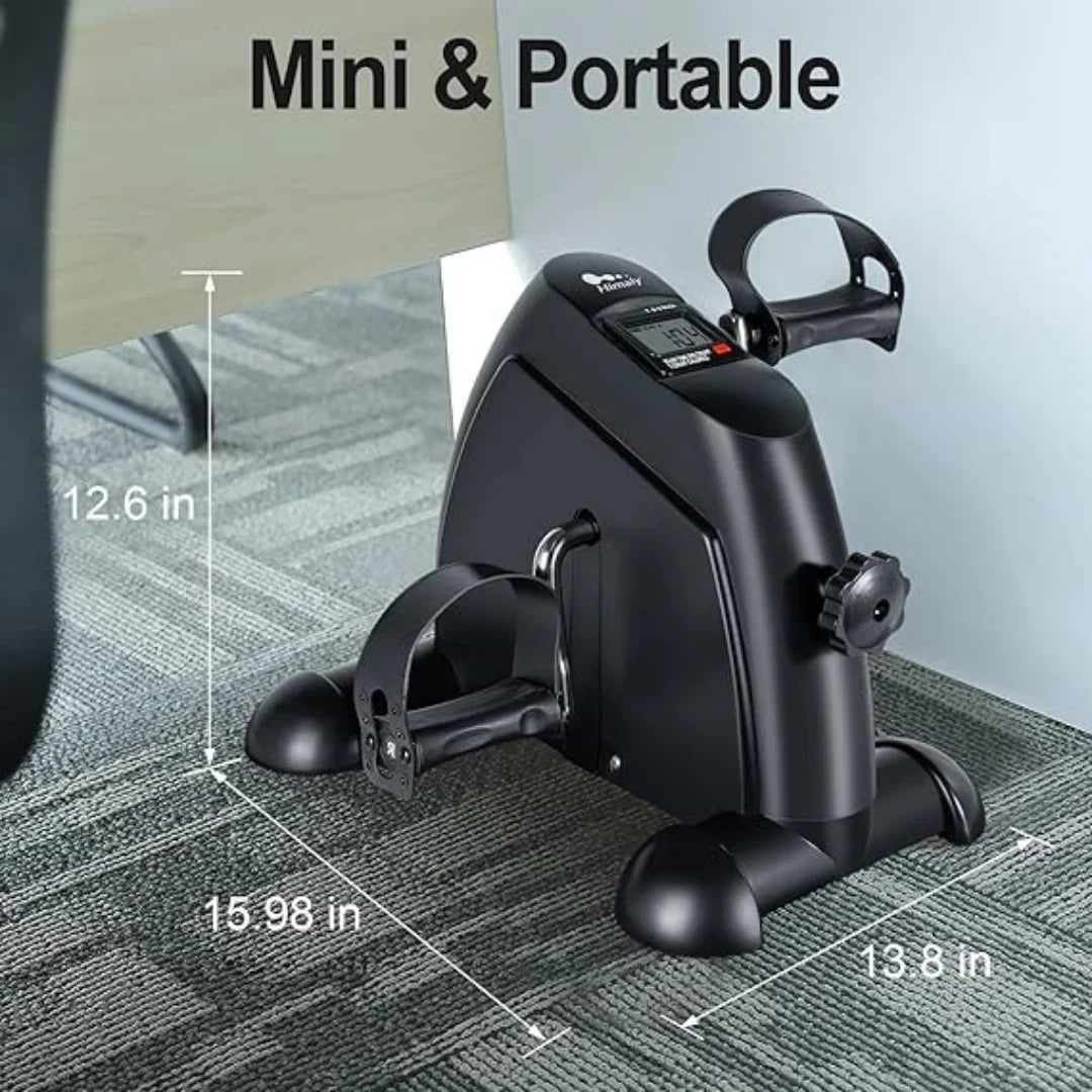 Mini portable pedal exerciser under desk on carpet, compact gym equipment by Aura Fit Pakistan.